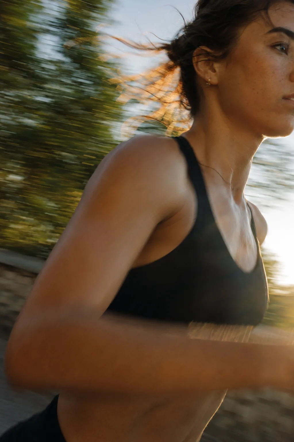 Runner in motion at golden hour, captured mid-stride